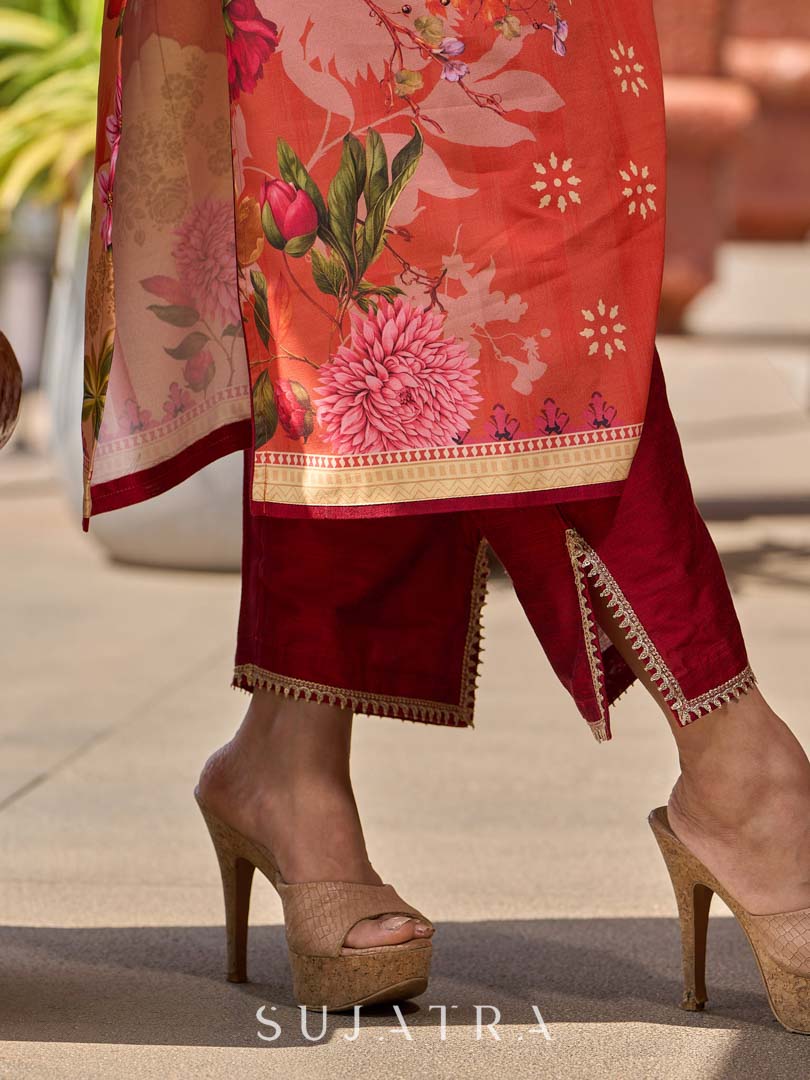 Elegant orange floral printed kurta with hand-embroidered sequin and cut dana detailing on the yoke and rich maroon accents.