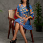 Indigo Kalamkari printed dress with vibrant red and mustard accents.