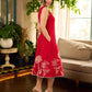 Vibrant red sleeveless dress with a bold off-white floral hand block print at the hem and clean off-white edging for a striking, handcrafted-inspired finish.