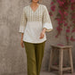 Contemporary off white and olive hand block print top features subtle geometric motifs, airy bell sleeves, and effortless elegance for versatile everyday styling.