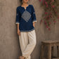 Captivating navy top adorned with a bold, rhythmic block print design, pleated sleeve detailing, and a versatile cut.