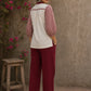 Chic off-white top featuring intricate hand block print sleeves in a vibrant red, complemented by a matching central decorative trim.
