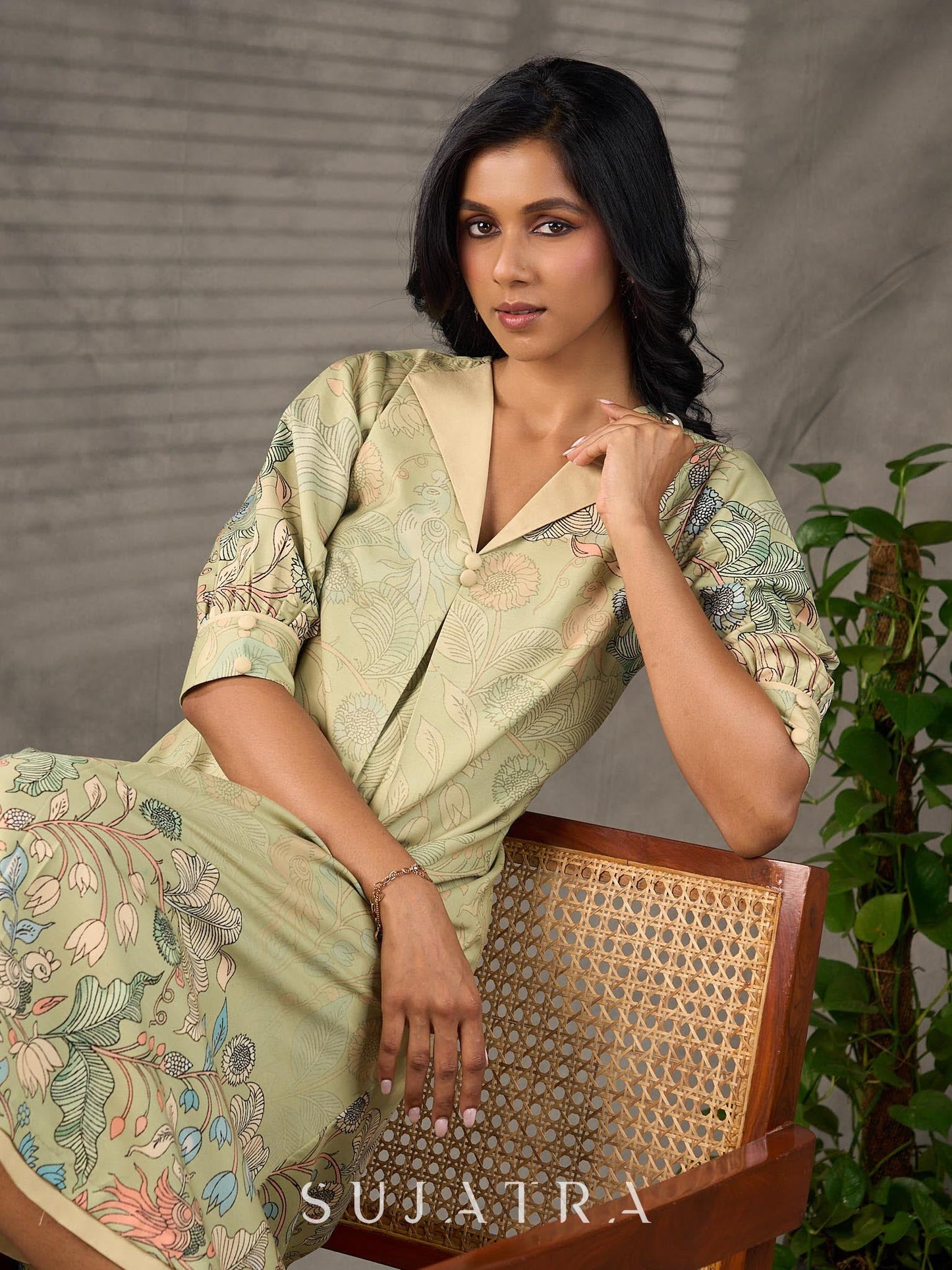 Soft green Kalamkari printed collared dress with centre pleat detailing.