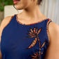 Modern navy dress enhanced by delicate, artistic Kalamkari side-applique work.