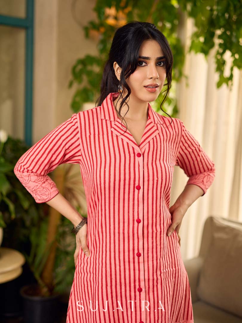 Peach and red block print stripe-floral shirt dress with fusion hand block printed stripes and jaal, a notch collar, and coordinated red accents for a vibrant, contemporary look.