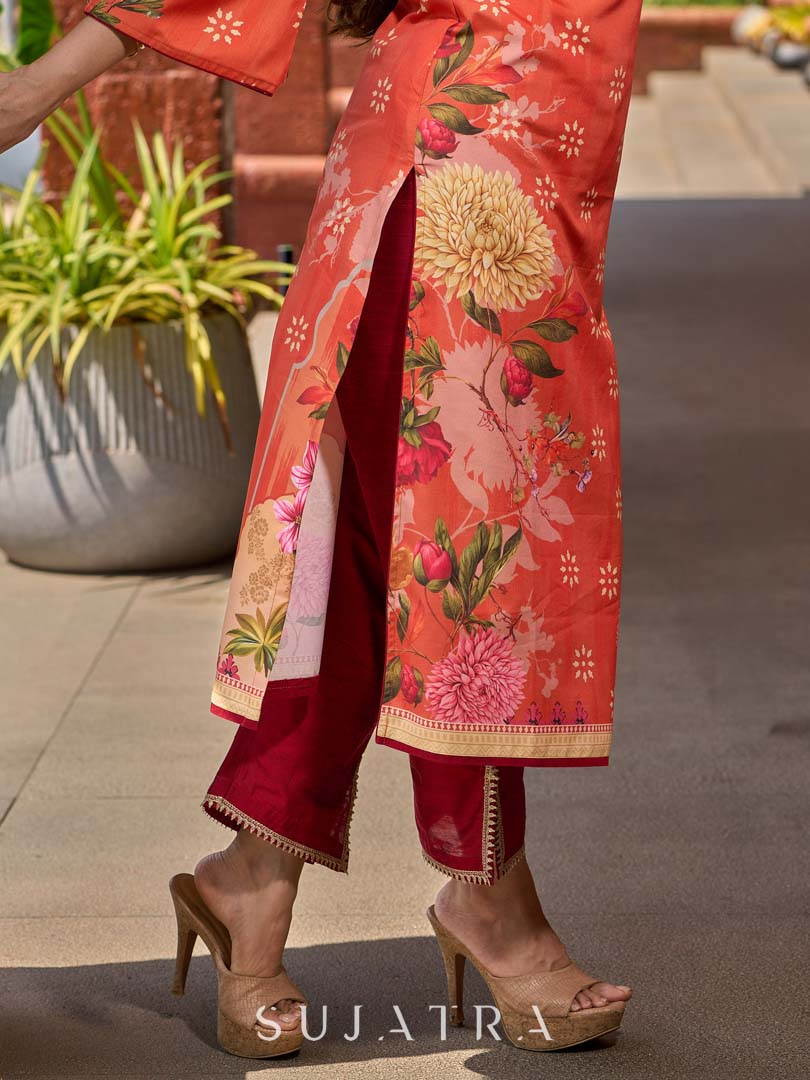 Elegant orange floral printed kurta with hand-embroidered sequin and cut dana detailing on the yoke and rich maroon accents.