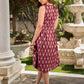 Statement maroon Ikat sleeveless dress elevated with pintuck detailing through the bodice and box pleats beyond the darts for a soft, flowing finish.