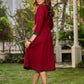 Chic maroon dress featuring a contrasting teal neck patch with charming Peter Pan collar details