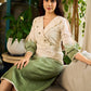 Serene ivory and sage green ombré overlap hakoba dress with olive button accents.