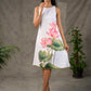 Graceful White lotus printed dress with elegant olive accents.