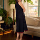 Black bias-cut block print halter dress with a red jaal hand block printed front panel, golden print detailing, and red accents for a striking, elegant statement look.