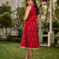 Statement red Ikat halter-neck dress accented in white, designed with a box pleat at the neckline for fluid drape.