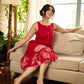 Vibrant red sleeveless dress with a bold off-white floral hand block print at the hem and clean off-white edging for a striking, handcrafted-inspired finish.