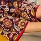 Mustard Kalamkari dress with an asymmetrical yoke and puffed sleeves.