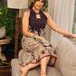 Black Heritage-inspired Kalamkari halter dress with elegant maroon contrast detailing.