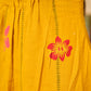 Mustard block printed pintuck dress with hand block red and pink vine floral motifs, accented with red and olive details for a rich, elegant look.