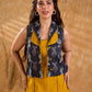 Tailored black Kantha jacket featuring fish motifs, a mustard pintuck patch, and a flipped collar, offering a structured silhouette with refined detail and distinctive, contemporary character.