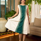 Bottle green and off-white hand block printed sleeveless dress with a block printed geometric panel, pearl embellishments, and refined accents for a contemporary artisanal look.