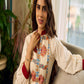 Artisan-crafted off-white Madhubani dress with beautiful hand-painted motifs and trim.