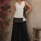 White cotton wrap-style top featuring contrast block print mantra borders, side tie, and modern silhouette.