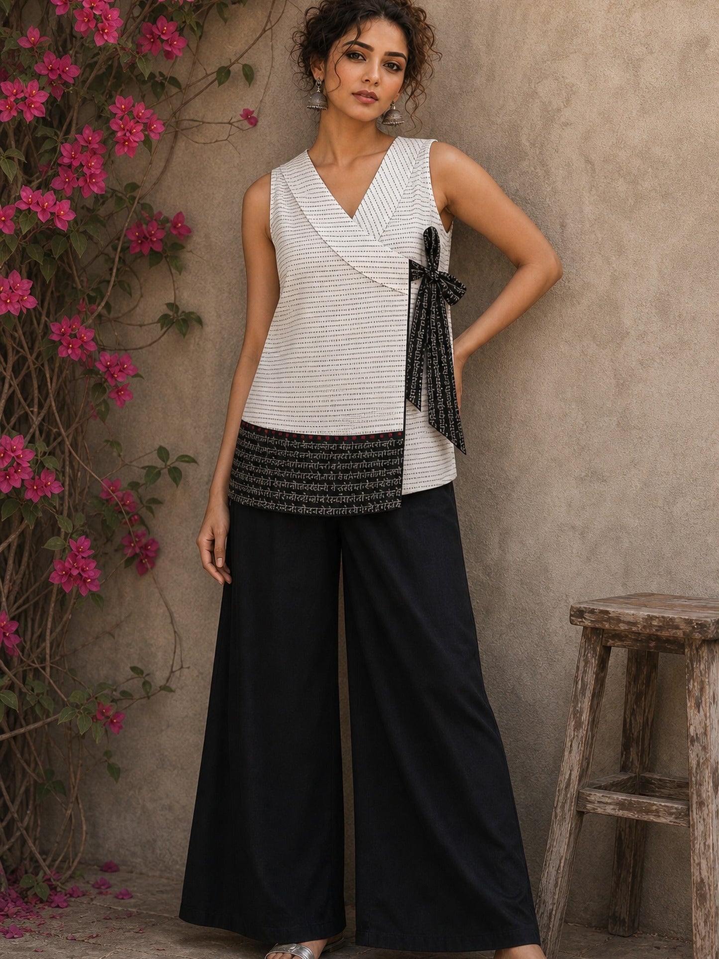 White cotton wrap-style top featuring contrast block print mantra borders, side tie, and modern silhouette.