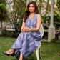 Graceful powder blue Ikat dress showcasing layered overlap details highlighted with white accents.