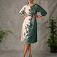 Bottle green and beige half and half dress with raglan sleeves and transitioning floral motifs.