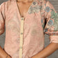 Peach Kalamkari-inspired shirt dress with soft beige accents.