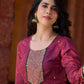 Exquisite deep burgundy printed kurta with intricate neck panel embroidery, delicate green beads, and refined green highlights.