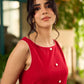 Vibrant red sleeveless dress with a bold off-white floral hand block print at the hem and clean off-white edging for a striking, handcrafted-inspired finish.