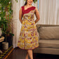 Elegant cream and maroon Madhubani dress featuring sophisticated wavy pintuck flap detailing.