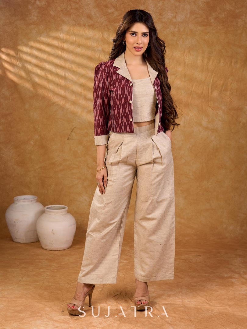 Smart maroon Ikat jacket featuring gathered sleeves, a cream notch collar, and subtle accents, creating a defined, structured silhouette suited for polished corporate wear.