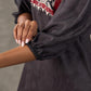 Black Kalamkari-inspired printed dress with maroon accents and pearl embellishments