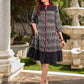 Black grey Ikat dress with soft frill detailing at the neckline, accented with red highlights, and finished with gentle gathers toward the bottom for a fluid silhouette