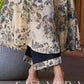 Elegant black–white floral kurta featuring a graceful bias silhouette, intricate mirror embroidery on the neck and sleeves, and a sweetheart neckline.