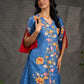 Indigo Kalamkari printed dress with vibrant red and mustard accents.