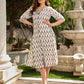 Modern white and grey Ikat shirt dress elevated with an asymmetrical checkered Ikat collar and contrast black accents.