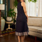 Modern black bias-cut dress showcasing unique artisan-inspired Kalamkari neck trim.