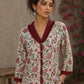 Soft white floral cotton top finished with maroon cuffs, pleated collar, and delicate feminine elegance.