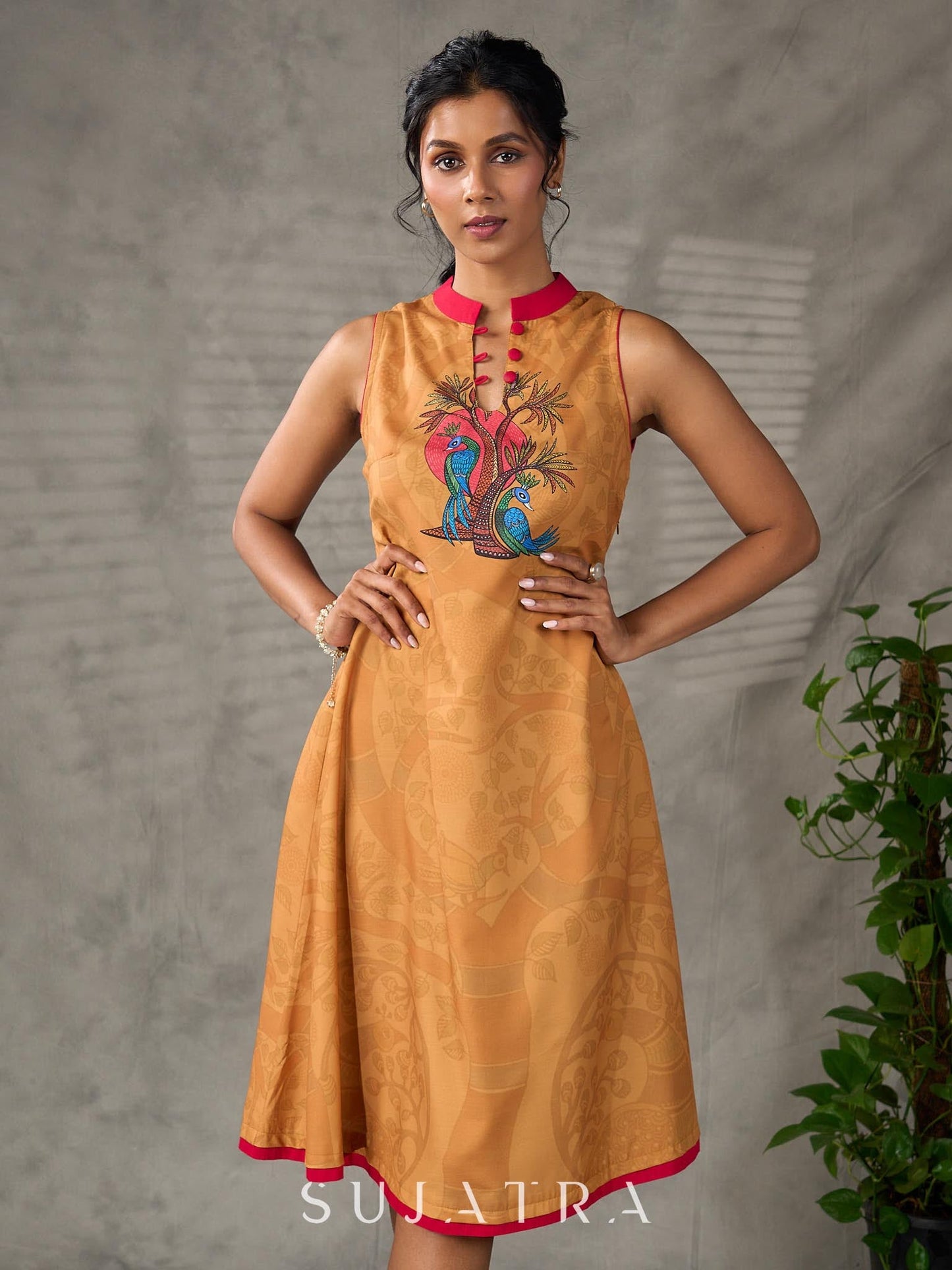 Mustard Gond printed mandarin collar dress with vibrant pink accents.