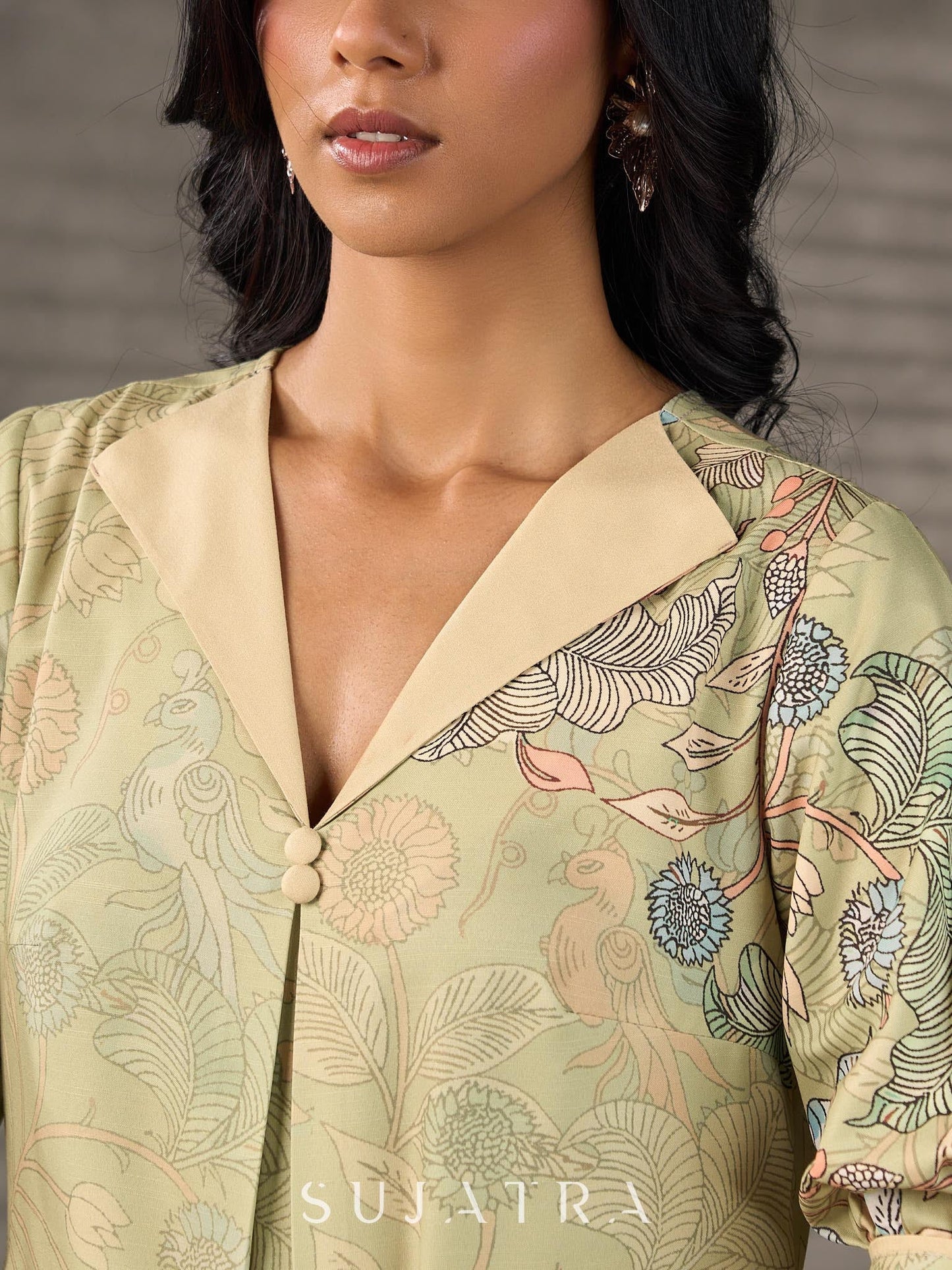 Soft green Kalamkari printed collared dress with centre pleat detailing.