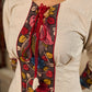 White and black striped dress with Kalamkari panel and tie-up neckline.