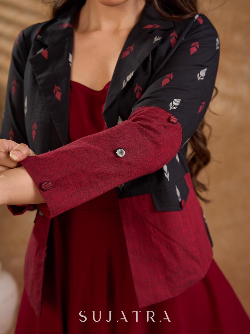 Sharp black and maroon half-and-half Jamdani jacket with functional flap pockets, offering a structured silhouette with bold contrast and refined detailing for elevated corporate styling.