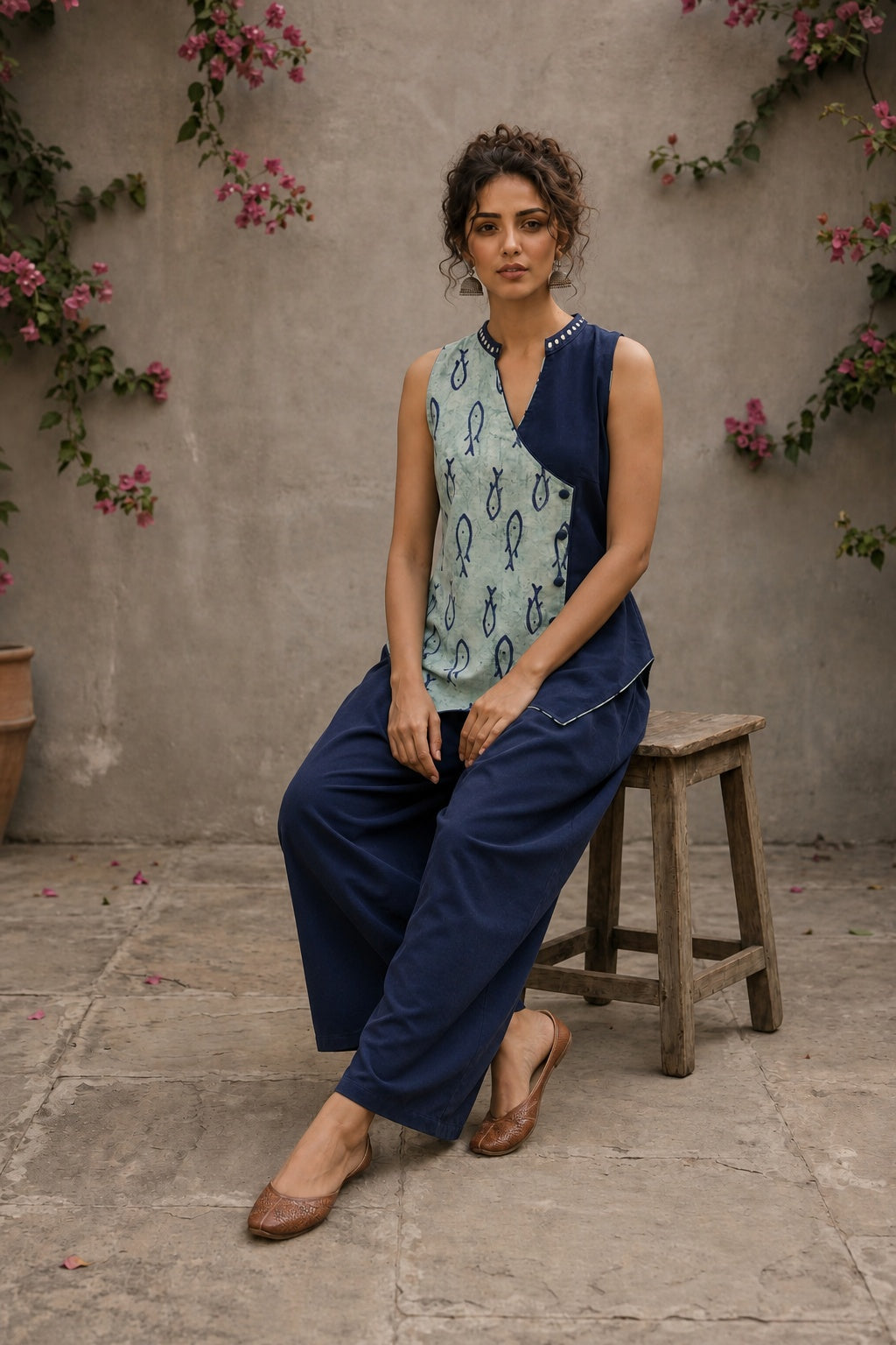 Indigo fish-print crossover sleeveless top featuring a mirror-laced Mandarin collar and beautifully scalloped cut hem.
