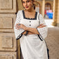 Effortless White Cotton Kurta Adorned with Polka Dot Sleeves & Delicate Scalloped Neckline