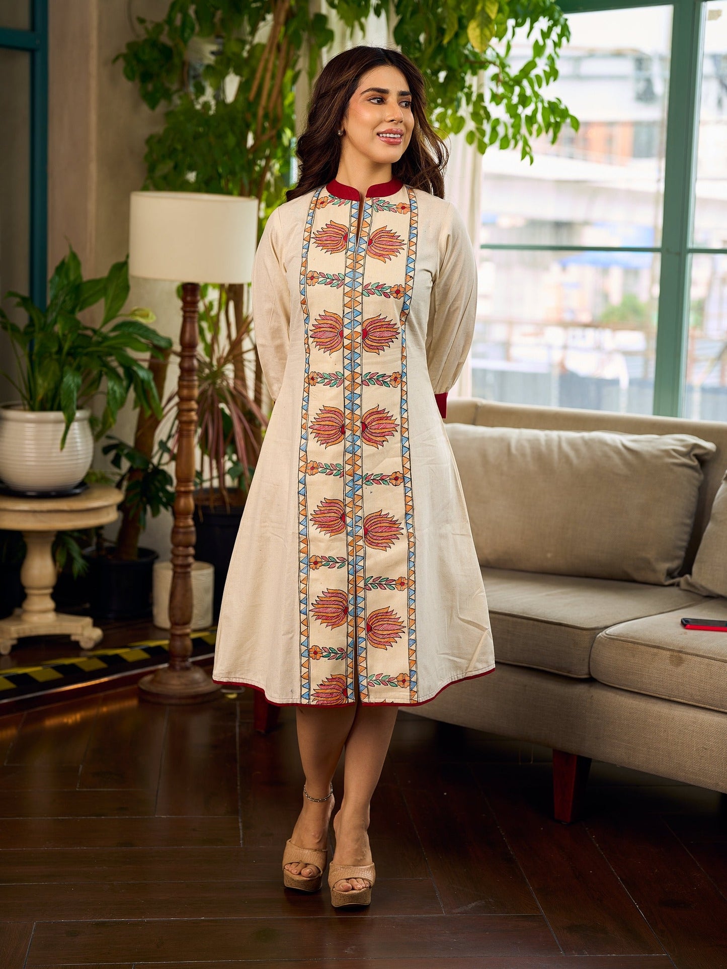 Artisan-crafted off-white Madhubani dress with beautiful hand-painted motifs and trim.