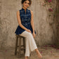 Contemporary indigo top with delicate dragonfly motifs, high folded collar, and graceful pleated hemline.