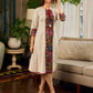 White and black striped dress with Kalamkari panel and tie-up neckline.