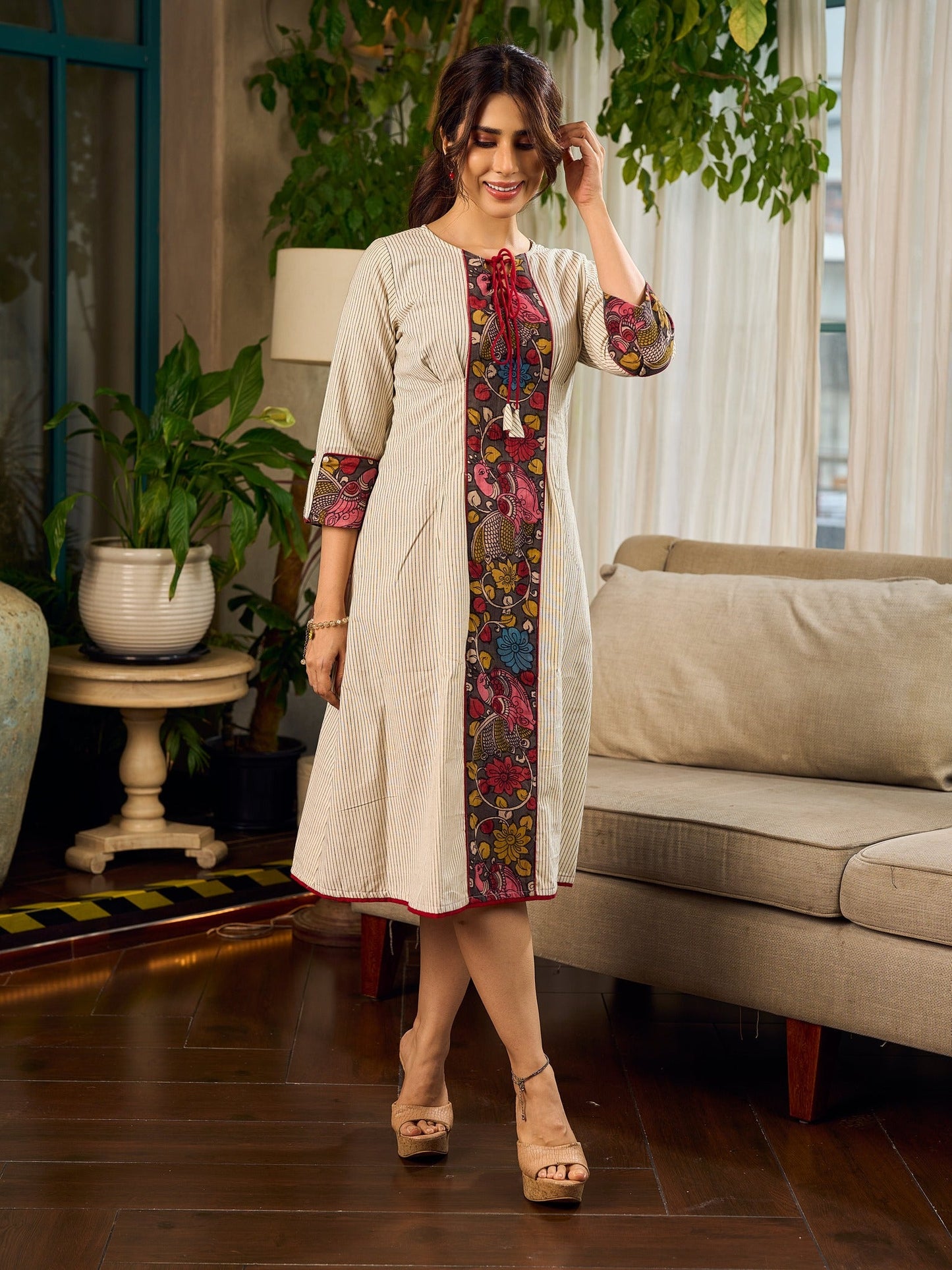 White and black striped dress with Kalamkari panel and tie-up neckline.