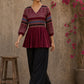 Bold and playful maroon hand block print peplum top with beige geometric motifs and subtle blue accents for effortlessly chic everyday style.